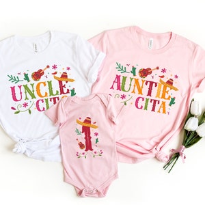 May include: Three pink and white t-shirts with the text "Uncle Cita", "Auntie Cita", and a sombrero graphic.