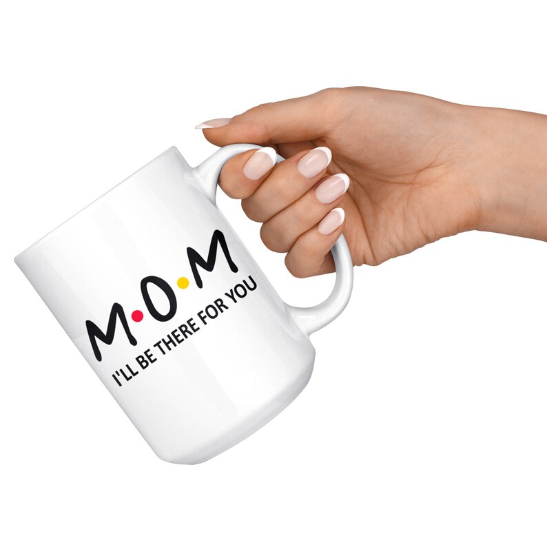 May include: White ceramic mug with a black and yellow design that says "M.O.M. I'll be there for you".