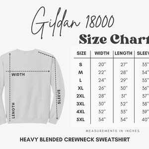 May include: Size chart for Gildan 18000 Heavy Blended Crewneck Sweatshirt. The chart shows measurements in inches for width, length, and sleeve length for sizes S through 5XL.