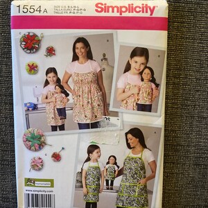 Simplicity 1554 apron and 18” doll apron and pin cushion sizes small-large
