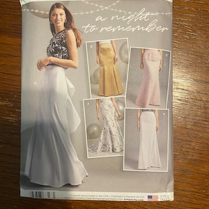 May include: A sewing pattern for a long skirt with a variety of styles. The pattern is for sizes 18W-26W and is from Simplicity. The pattern is called "a night to remember".