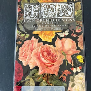 May include: A package of Iron Orchid Designs transfer sheets. The design features large, peach and red roses, yellow roses, and butterflies on a black background. The package reads "IRON ORCHID DESIGNS TRANSFER BY ANY OTHER NAME EIGHT 8" x 12" SHEETS."