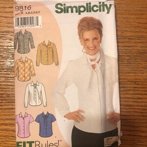 May include: Simplicity sewing pattern number 9816 for a blouse with a bow tie. The pattern includes six different variations of the blouse, including a leopard print, plaid, and solid white. The pattern is designed by Karen.