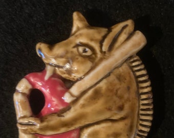 Ceramic bagpiping boar badge