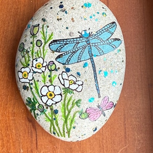 Metallic Dragonflies painted rock SEALED among white flowers with glitter added