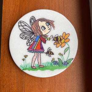 Whimsical girl, a flower and bees painted rock SEALED