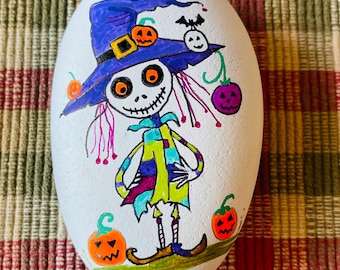 Quirky Skeleton painted rock SEALED pumpkins/eyes glow under black light