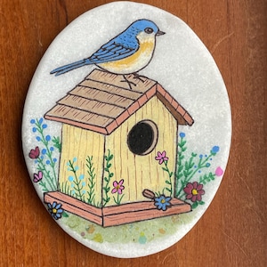 Bird on birdhouse painted rock SEALED