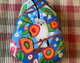 Bird painted rock SEALED among flowers
