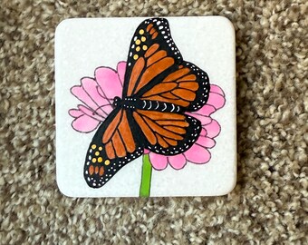 Monarch butterfly painted rock - on pink flower SEALED