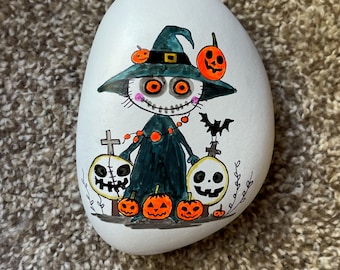 Quirky Skeleton painted rock SEALED pumpkins/eyes glow under black light