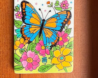Butterfly Painted Rock SEALED among flowers