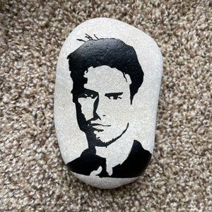 Tom Cruise silhouette painted rock