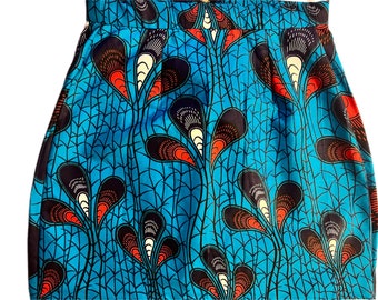 May include: A blue skirt with a colorful floral pattern. The pattern features red, black, and white accents. The skirt is made of a woven fabric.