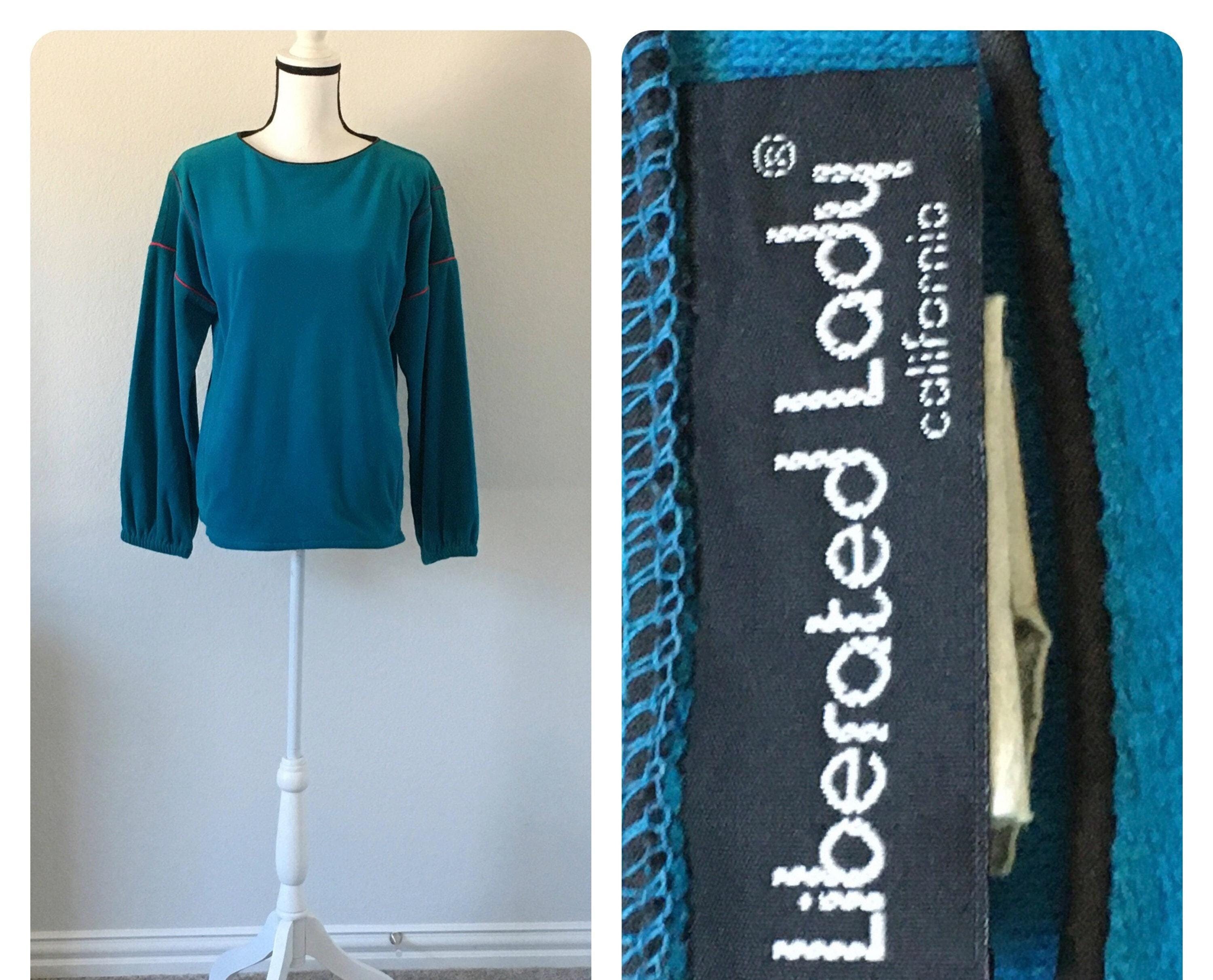 1970 年代のターコイズ ベロア スウェットシャツ、パイピング付き