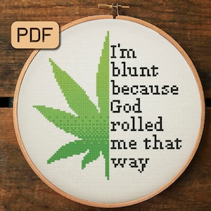 May include: A white embroidery hoop with a green marijuana leaf design and the text "I'm blunt because God rolled me that way".