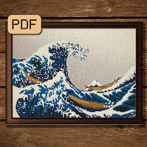 May include: A cross-stitch pattern of a famous Japanese artwork, The Great Wave off Kanagawa, featuring a large blue wave with white foam and a mountain in the background.
