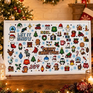 May include: A framed cross-stitch sampler featuring a grid of colorful pixel-art Christmas icons, including a snowman, reindeer, Santa, and trees. The text reads LET IT SNOW, NOEL, HO HO HO, MERRY CHRISTMAS, and JOY, all set against a white fabric background.