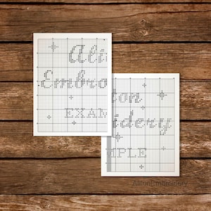May include: Black and white cross stitch pattern for a Christmas bauble. The pattern includes the text "Merry Christmas" and a star.