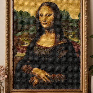 May include: A framed cross-stitch of the Mona Lisa portrait. The artwork features a gold frame and a detailed depiction of the famous painting. The colors include shades of brown, green, and black.