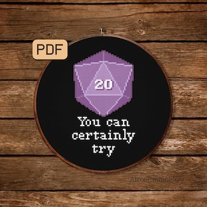May include: A purple 20-sided die with the number 20 on it, surrounded by a black circle with the text "You can certainly try" in white. The image is on a wooden background.