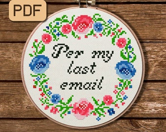 May include: A white embroidery hoop with a floral wreath design and the text "Per my last email" in black lettering.