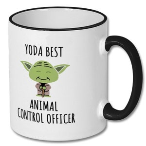 May include: White ceramic mug with a black rim and handle. The mug has a cartoon image of Yoda with the text "Yoda Best Animal Control Officer".