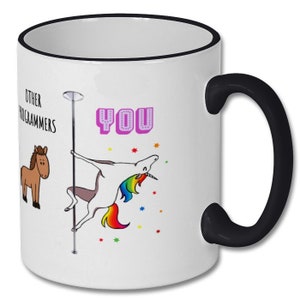 May include: White ceramic coffee mug with a black rim and handle. The mug features a cartoon unicorn with a rainbow mane and tail, holding onto a pole. The text "OTHER PROGRAMMERS" is on the left side of the mug, and the text "YOU" is on the right side of the mug.
