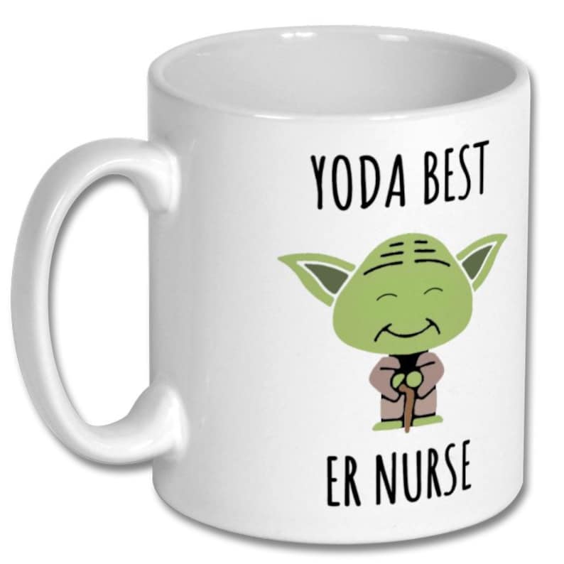 May include: White ceramic coffee mug with a green Yoda character illustration and the text "Yoda Best Er Nurse".