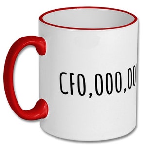 May include: White ceramic coffee mug with a red rim and handle. The mug has black text that reads "CFO,000,000".