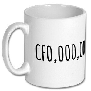 May include: White ceramic coffee mug with black text that reads "CFO,000,000".
