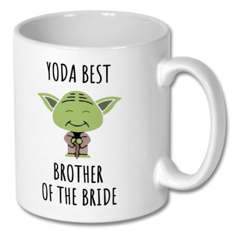 May include: White ceramic mug with a green Yoda character illustration and the text "Yoda Best Brother of the Bride".