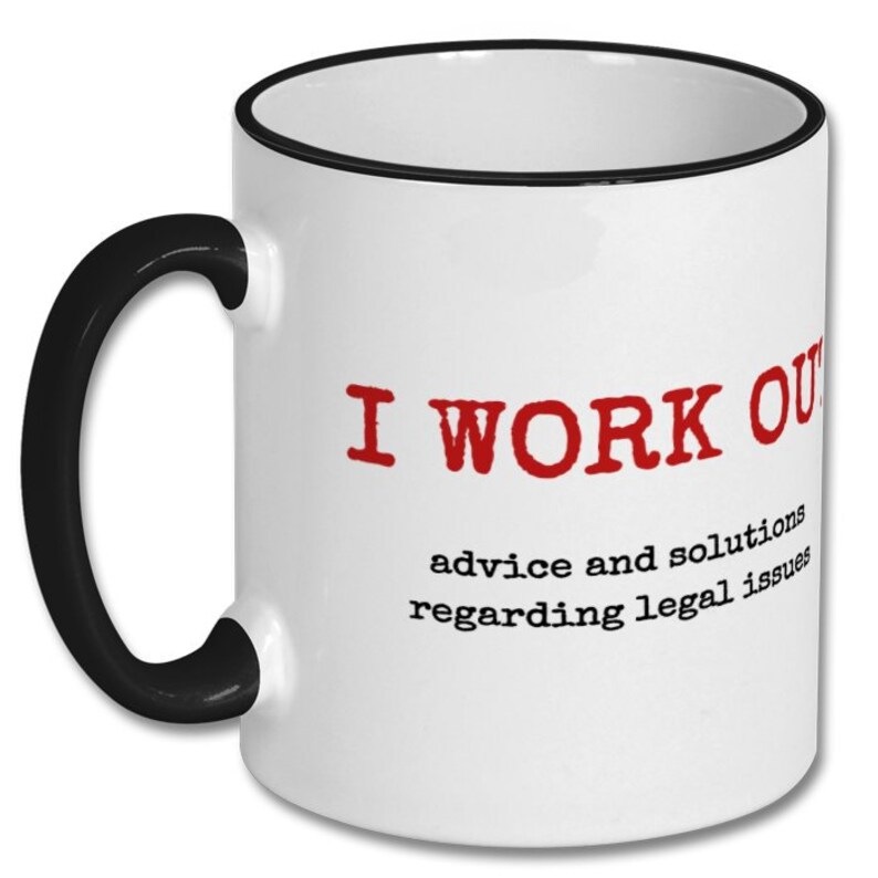 May include: White coffee mug with a black rim and handle. The mug has red text that reads "I WORK OUT advice and solutions regarding legal issues".