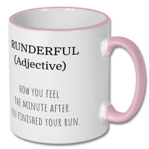 May include: White ceramic coffee mug with a pink rim and handle. The mug has black text that reads "RUNDERFUL (Adjective) HOW YOU FEEL THE MINUTE AFTER YOU FINISHED YOUR RUN."