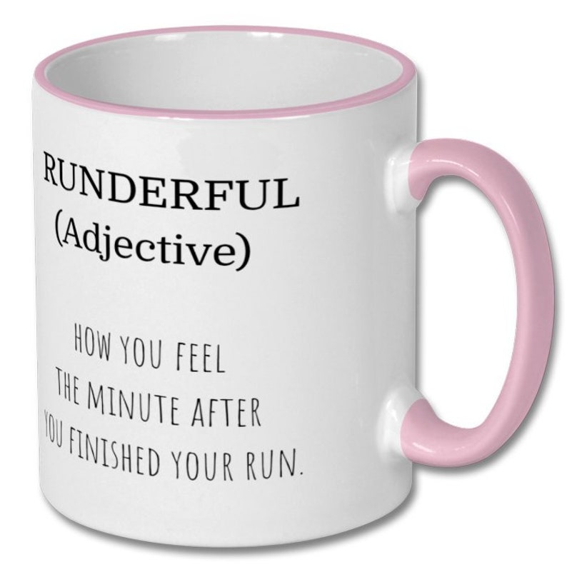 May include: White ceramic coffee mug with a pink rim and handle. The mug has black text that reads "RUNDERFUL (Adjective) HOW YOU FEEL THE MINUTE AFTER YOU FINISHED YOUR RUN."