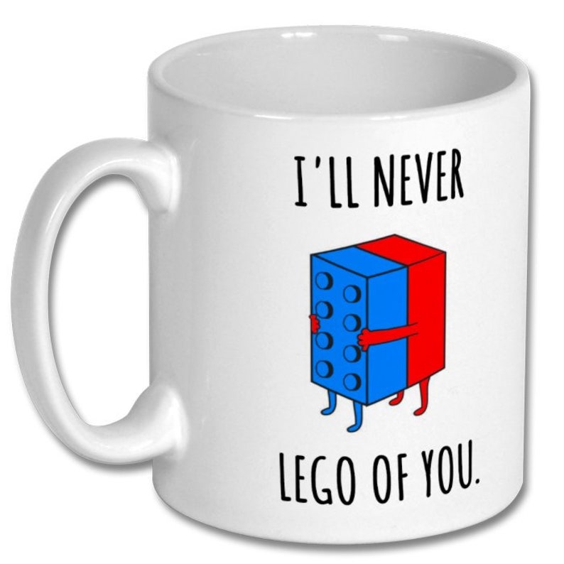 May include: White ceramic coffee mug with a blue and red Lego block design and the text "I'll never lego of you."