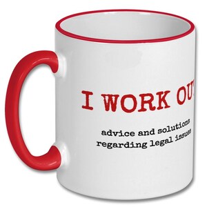May include: White ceramic coffee mug with a red rim and handle. The mug has the text "I WORK OUT advice and solutions regarding legal issues" printed in red.