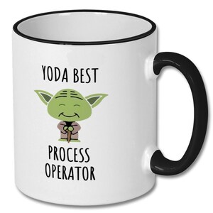 May include: White ceramic mug with a black rim and handle. The mug features a cartoon image of Yoda from Star Wars, with the text "Yoda Best Process Operator".