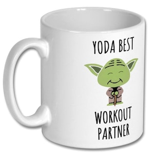 May include: White ceramic mug with a green Yoda character illustration and the text "Yoda Best Workout Partner".
