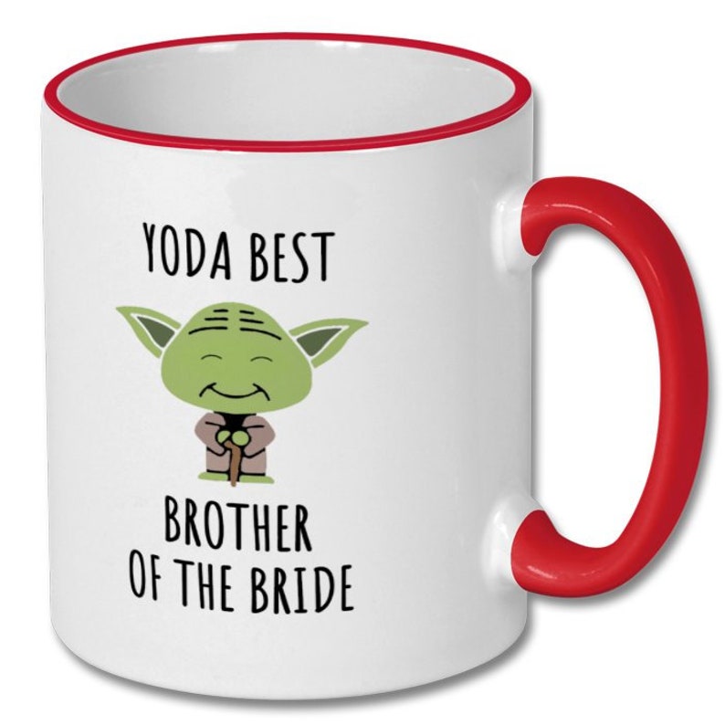 May include: White ceramic mug with a red rim and handle. The mug features a cartoon image of Yoda from Star Wars with the text "Yoda Best Brother of the Bride".