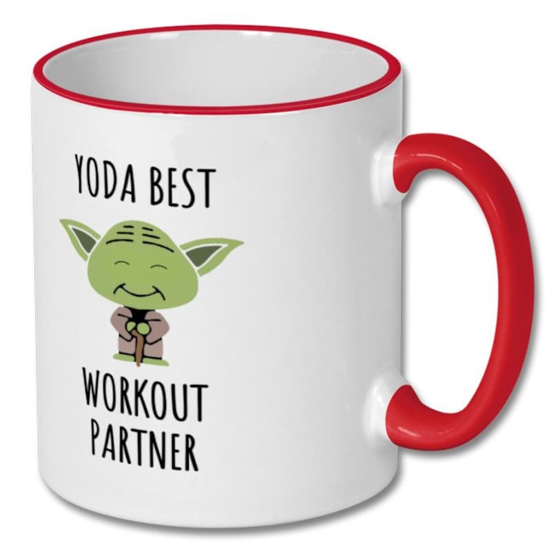May include: White ceramic mug with a red rim and handle. The mug features a cartoon image of Yoda from Star Wars with the text "Yoda Best Workout Partner".