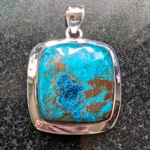 May include: A rustic wooden sign with the text "Welcome to our home" in white lettering. The sign features a distressed finish and a simple, inviting design, perfect for entryway decor.