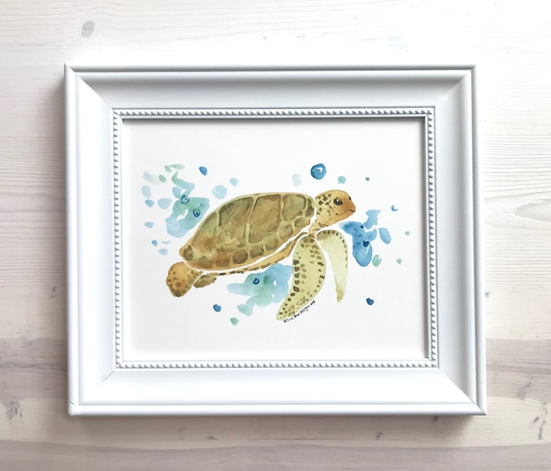 May include: A watercolour painting of a sea turtle swimming in blue and green water. The turtle is brown with a yellow underside and has a white signature in the bottom right corner.