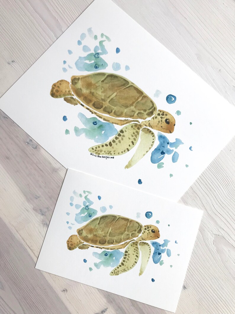 May include: Two watercolour paintings of sea turtles swimming in blue and green water. The larger painting shows a turtle with a brown shell and the smaller painting shows a turtle with a green shell.