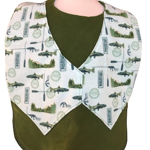 May include: A white bib with a green and brown fishing-themed print. The bib has a V-neck and is made of a soft, comfortable fabric. The bib is perfect for keeping clothes clean during mealtime.