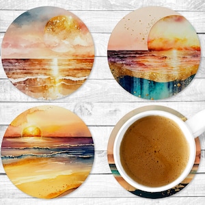 May include: Set of four round coasters featuring watercolor paintings of sunsets over the ocean. Each coaster depicts a different sunset scene with varying shades of orange, yellow, pink, and blue.