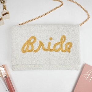a white purse sitting on top of a table