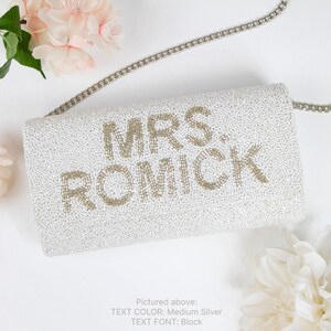 a white purse with the words mrs romick on it