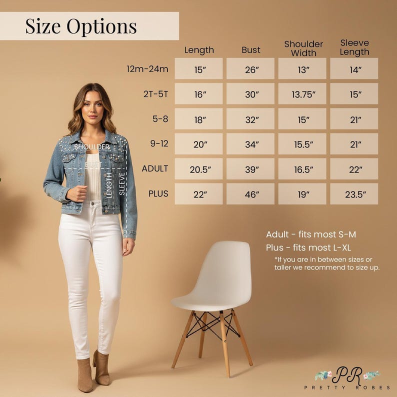 a woman standing in front of a size chart for clothing items. She is wearing a denim jacket and white pants. The chart provides size options for different age groups and sizes, including bust, shoulder, sleeve, and length measurements.