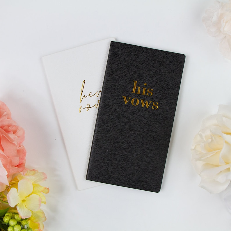 a couple of cards that are next to some flowers